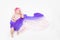Top view of cute baby girl dressed in a fairy costume - fluttering long scarf and headband. Space for text