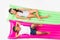 top view of cute multiethnic kids in swimwear lying on swimming mattresses