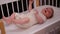 Top view cute newborn baby in white bodysuit lying down