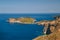 A top view at dark blue Ionian Sea, Asos village and Assos peninsula from a road. Aerial view, summer scenery of famous and
