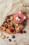 top view of delicious muffin in shape of bear with berries on wooden