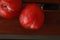 Top view of delicious plums on a wooden surface background