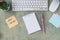 top view of the desktop with note with words NEW CAREER, empty notepad, pen, keyboard, cactus and mause on a wooden