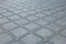 Top view of diagonal grey diamond shaped square pavement of different sized, top view. Exterior design paving tile