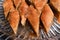 Top view of diamond shape homemade Turkish baklava in a glass plate. Baklava with walnut. Cevizli baklava in Turkish