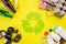Top view of Different garbage materials with recycling symbol on table background. Recycle, World Environment Day and Eco concept