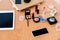 top view of digital devices and various cosmetics on table