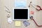 Top view of doctors desk with tablet and medical appliance