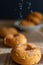 Top view of donuts on bokeh with black background and sugar straying