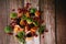 Top view, Dried fruits with kiwi slices, strawberry, dried mango slices, orange, and prunes on wooden plate. Organic healsy