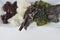 Top view of dried kelp, nori, dulse, wakame, alaria and agar agar seaweed