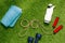 Top view of dumbbells, towel and bottle with jump rope in shape of word go