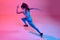 Top view dynamic image of professional female runner, athlete training over pink studio background in neon light