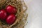Top view of easter decorative nest with red eggs inside