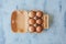 Top view of eggs in the package. Eggs on wooden background.