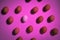 Top view of eggs in pink background