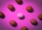 Top view of eggs in pink background