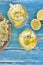 Top view of elderflower lemonade with basket of elderberry flowers