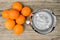 Top view of electric citrus juicer with oranges prepared for squeezing