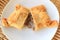 Top view of Empanada de Pino or beef filled Empanada, delicious Chilean baked pasty served on white plate