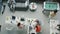 Top view of employees working and playing foosball in modern open space office