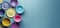 Top view of empty crockery plates and cups on a blue neutral background