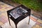 Top view empty grill grate over flaming charcoals on the barbeque grill in backyard, ready for placing marinated food.