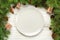 Top view. Empty plate round ceramic on wooden christmas background. holiday dinner dish concept with new year decor