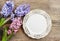 Top view on empty plate on wooden table