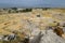 Top view of the excavation site in ruined ancient city of Hierapolis. The remains of destroyed buildings and columns