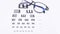 Top view of eye chart with glasses  ophthalmologist concept