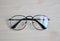 Top view Eyeglasses on wood table.