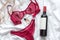 Top view fashion red lace lingerie with bootle of red wine and perfume. Set of woman essential accessory and underwear