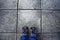 Top view of feet in blue color shoes standing on concrete floor