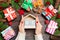 Top view of female hands holding a calendar on wooden background. The first of January. Holiday decorations. New Year concept