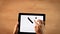 Top view female hands writing Y letter, coordinate system,equation on tablet
