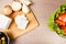 Top view of feta white cheese on wooden board