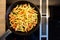 Top view finger shaped potato dumplings in a cast iron pan