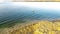 Top view fisherman wade fishing with waterproof jacket wader at Lavon Lake, Texas, USA