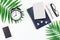 Top view flat lay office workspace desk styled design office supplies alarm clock tropical palm leaves smartphone copy space black