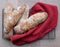 Top view of floury home made ciabatta sour dough loaves cooling on a wire tray, baked during the Coronavirus lockdown.