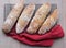 Top view of floury home made ciabatta sour dough loaves cooling on a wire tray, baked during the Coronavirus lockdown.