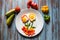 Top view of flower shaped food created with poached eggs and fresh vegetables and ingredients