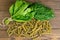 Top view of foglie spinach pasta on black wooden table. Top views,close-up