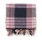 Top view of folded plaid cloth with tassels