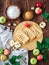 Top view food photography. Baked puff pastry crispy apple puff with ingredients on a rustic wooden table. Puff pastry pies with