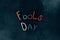 top view of fools day lettering made of plasticine