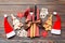 Top view of fork and knife tied up with ribbon on napkin on wooden background. Close up of christmas decorations and New Year tree