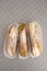 Top view of four delicious cannoli on wooden background