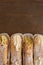 Top view of four delicious cannoli on wooden background